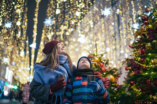Little boy and mother at a christmas festival