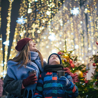 Little boy and mother at a christmas festival