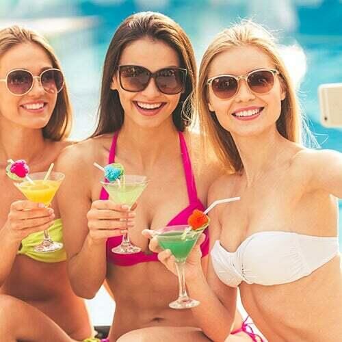 Girls having a drink at the pool